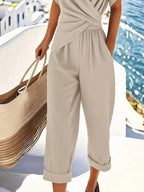 Plus size women's lounge set with twist-front V-neck top and matching pants with pockets, comfortable and stylish for relaxed wear.