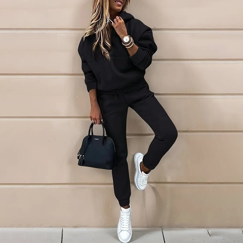 Women's two-piece solid color hooded sweatshirt set by FitiqueFit, featuring a casual hoodie and matching sweatpants.