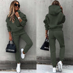 Women's two-piece solid color hooded sweatshirt set by FitiqueFit, featuring a casual hoodie and matching sweatpants.
