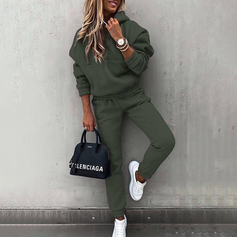 Women's two-piece solid color hooded sweatshirt set by FitiqueFit, featuring a casual oversized hoodie and matching sweatpants.