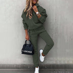 Women's two-piece solid color hooded sweatshirt set by FitiqueFit, featuring a casual oversized hoodie and matching sweatpants.