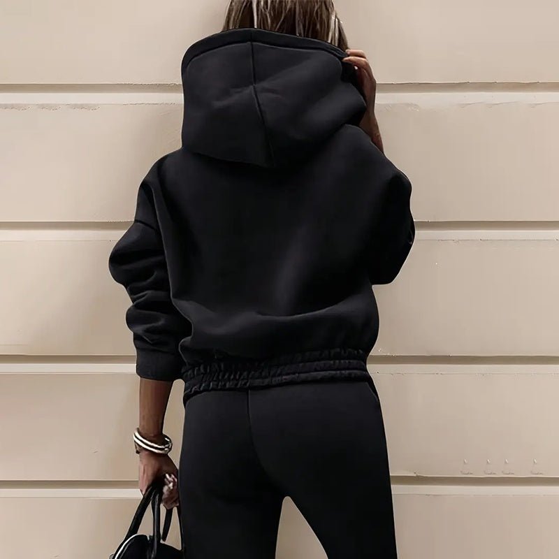 Women’s two-piece solid color hooded sweatshirt set by FitiqueFit, featuring a casual hoodie and matching sweatpants.