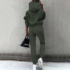 Women's two-piece solid color hooded sweatshirt set by FitiqueFit, featuring a cozy hooded top and matching pants for casual wear.