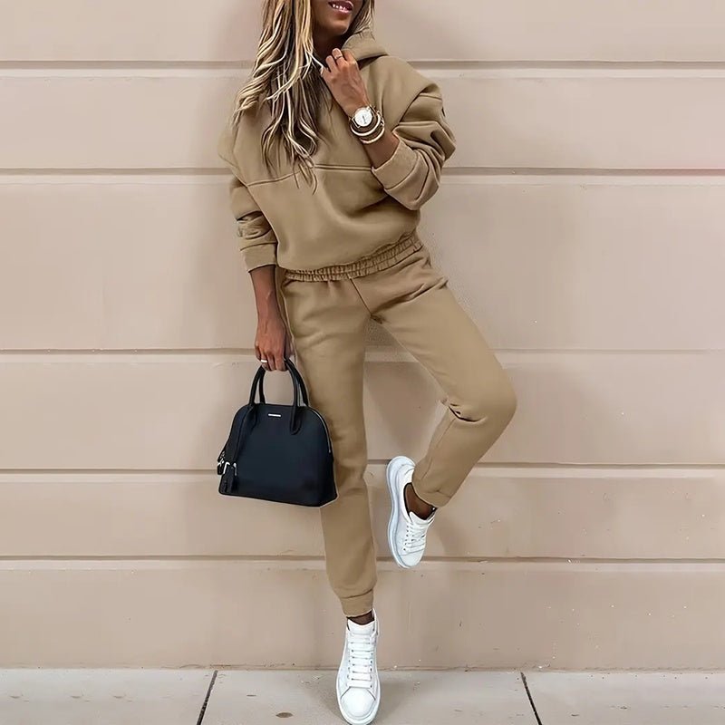 Women's two-piece solid color hooded sweatshirt set by FitiqueFit, featuring a casual hoodie and matching pants for comfortable wear.