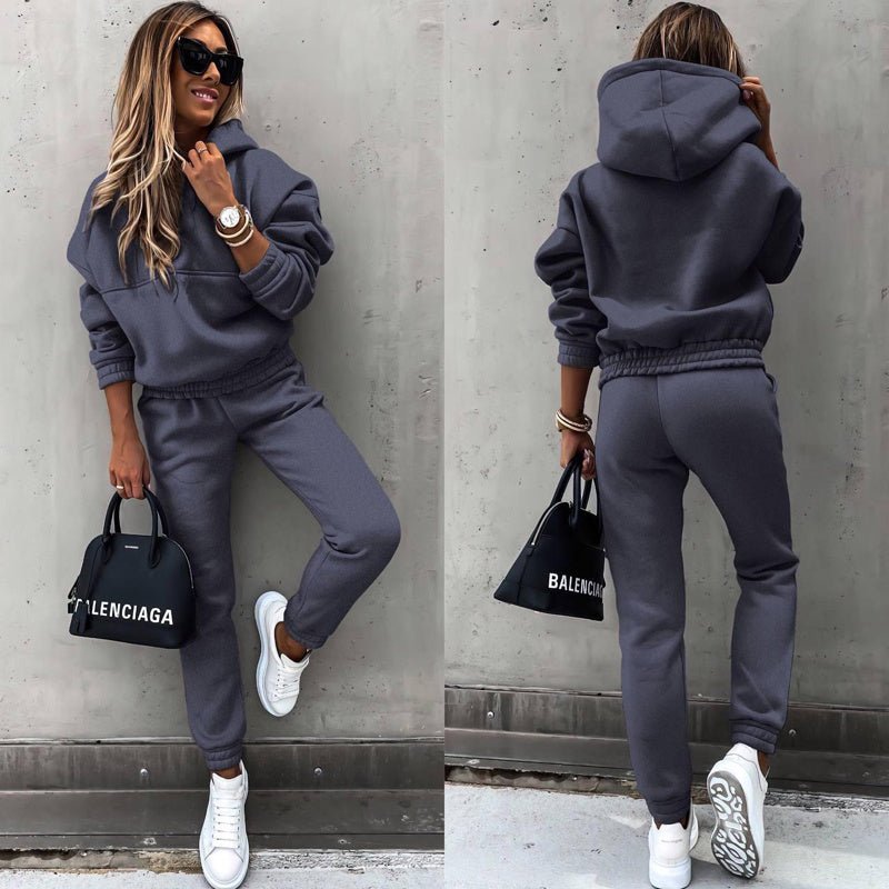 Women's two-piece solid color hooded sweatshirt set by FitiqueFit, featuring a casual, comfortable hoodie and matching sweatpants.