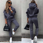 Women's two-piece solid color hooded sweatshirt set by FitiqueFit, featuring a casual, comfortable hoodie and matching sweatpants.
