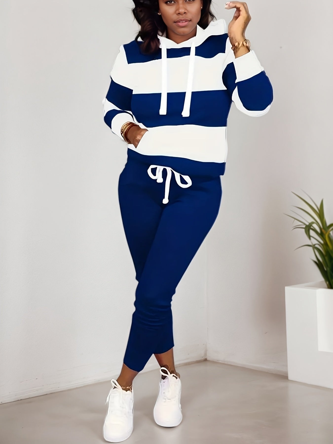 Women’s casual two-piece sportswear set by FitiqueFit with a sweatshirt and matching pants, ideal for comfortable active wear.