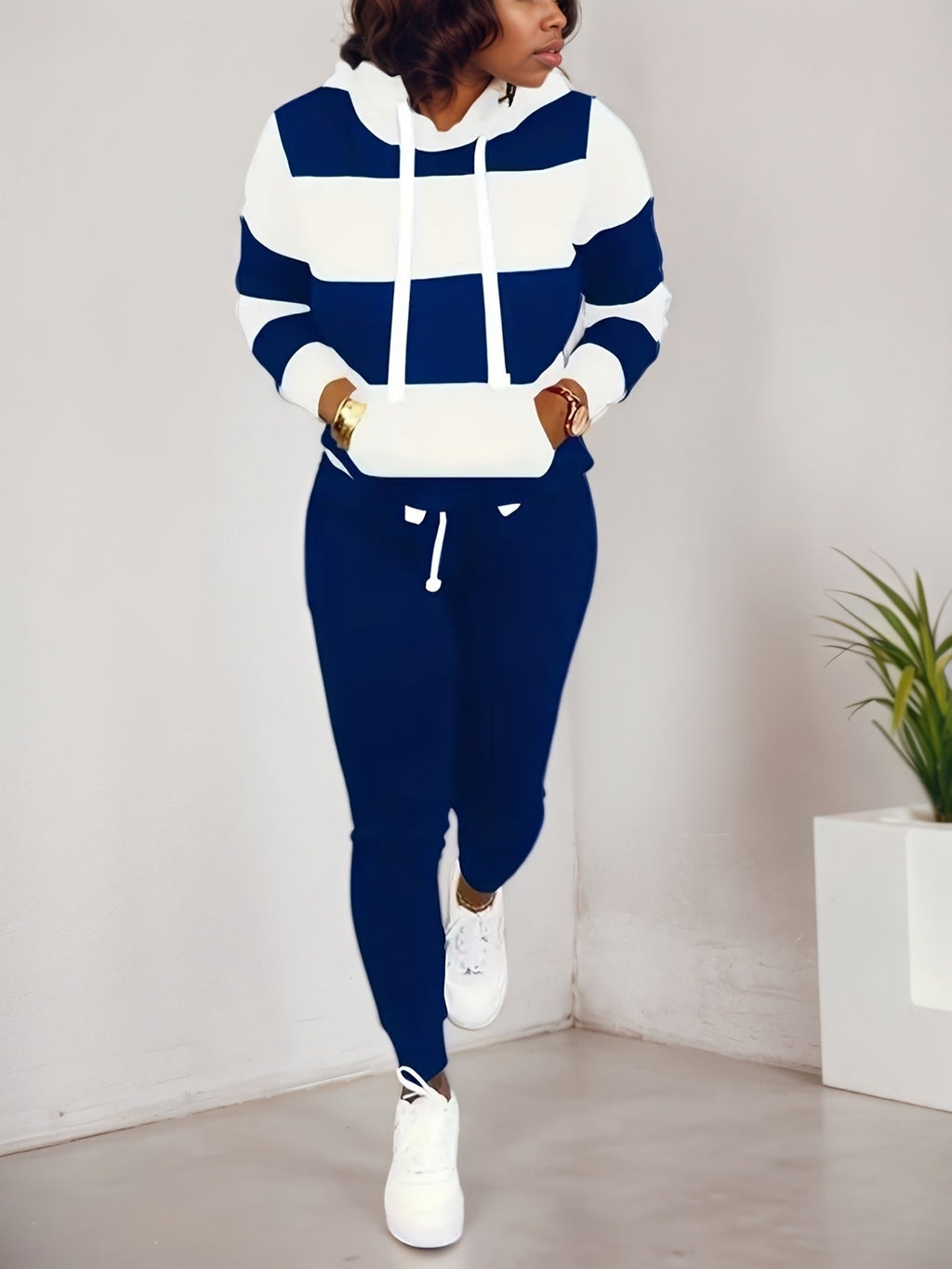 Women’s casual two-piece sportswear set by FitiqueFit, featuring a sweatshirt and matching pants for comfortable activewear.