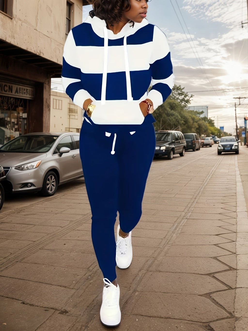 Women’s two-piece casual sportswear set by FitiqueFit with a sweatshirt and matching pants, perfect for active or relaxed wear.