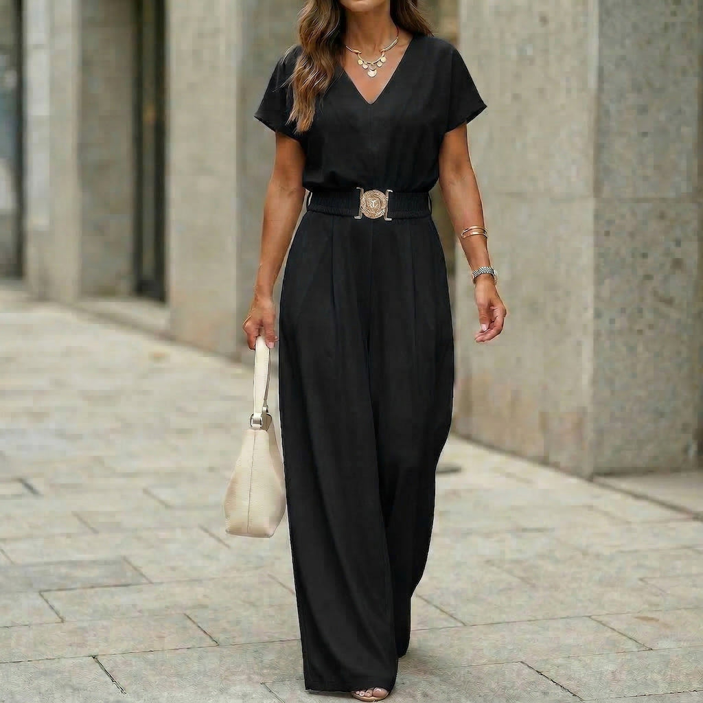 Women's FitiqueFit V-neck belted wide-leg casual jumpsuit displayed on a model, featuring a relaxed fit and stylish belt detail.