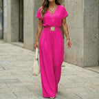 Women's V-neck belted wide-leg jumpsuit by FitiqueFit, casualwear with a V-neckline, belt at waist, and flowing wide-leg design.