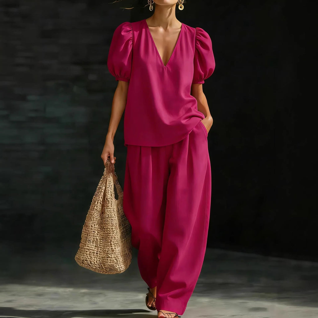 Women's V-neck casual two-piece set by FitiqueFit, featuring a comfortable top and matching pants in a relaxed style.