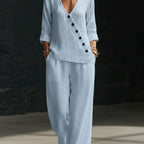 Women’s V-neck crossover shirt and wide-leg pants casualwear set by Plush Fashion Hub, displayed on a model.
