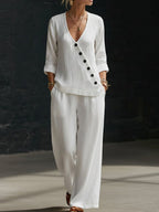 Women’s V-neck crossover shirt and wide-leg pants casualwear set by Plush Fashion Hub, featuring a relaxed fit and stylish design.