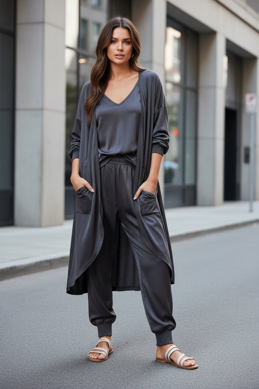 Women’s V-neck long sleeve solid color loose jumpsuit by FitiqueFit with two side pockets, casualwear style.
