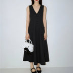Women's sleeveless V-neck pencil dress by FitiqueFit, featuring button-up front and casual style, shown on a model.
