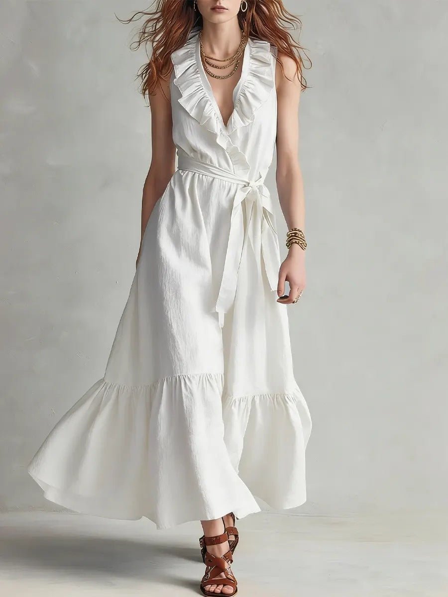 Women's V-neck sleeveless maxi dress with lace-up panels and wide flare, casualwear by FitiqueFit, shown in a stylish outdoor setting.
