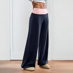 Women’s wide-leg patchwork casual pants by FitiqueFit, featuring a relaxed fit and colorful patchwork design.