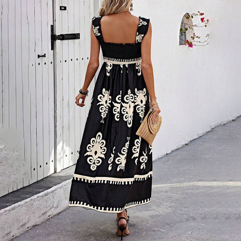Women’s wide-strap printed maxi dress by FitiqueFit, casualwear with colorful floral pattern and flowing fabric.