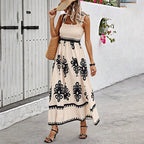 Women's wide-strap printed maxi dress by FitiqueFit, casualwear with vibrant floral pattern and flowing silhouette.
