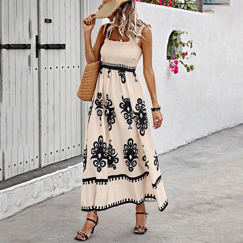 Women's wide-strap printed maxi dress by FitiqueFit, casualwear with vibrant floral pattern and flowing silhouette.