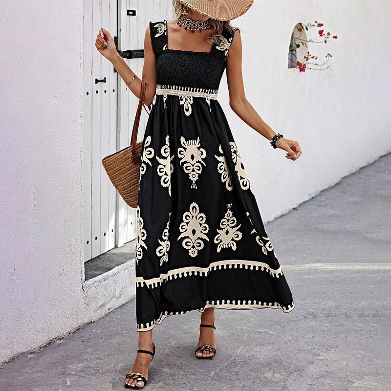 Women’s wide-strap printed maxi dress by FitiqueFit, casualwear with a flowing, colorful floral pattern.