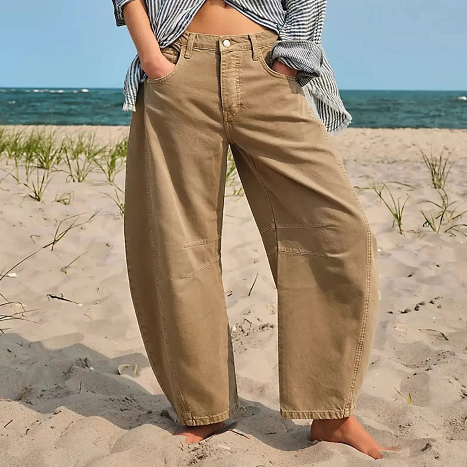 Women’s Y2K baggy mid-waist wide-leg jeans by FitiqueFit, showcasing relaxed fit and 90s streetwear style.