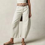 Women’s Y2K baggy mid-waist wide-leg jeans by FitiqueFit, casualwear with a 90s streetwear vibe, shown in a relaxed fit.