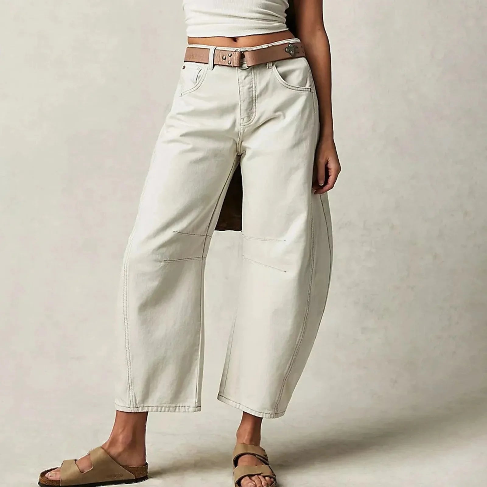 Women’s Y2K baggy mid-waist wide-leg jeans by FitiqueFit, casualwear with a 90s streetwear vibe, shown in a relaxed fit.