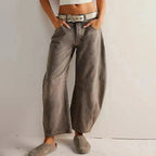Women's Y2K baggy mid-waist wide-leg jeans by FitiqueFit, showcasing relaxed fit, high waist, and 90s streetwear style.