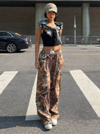 Women's Y2K camouflage cargo pants by FitiqueFit, casualwear style with pockets and a relaxed fit, shown on a model.