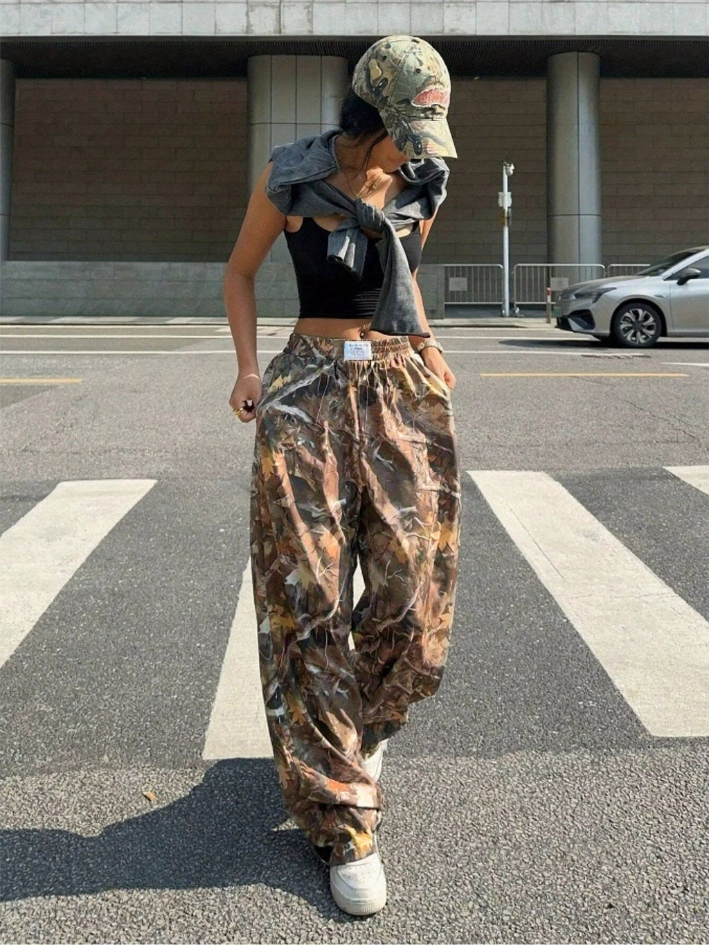 Women's Y2K camouflage cargo pants by FitiqueFit, casualwear style with multiple pockets and a trendy Y2K-inspired print.