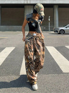 Women's Y2K camouflage cargo pants by FitiqueFit, casualwear style with multiple pockets and a trendy Y2K-inspired print.