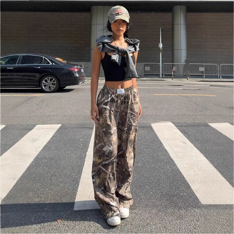 Women’s Y2K camouflage cargo pants by FitiqueFit, showcasing relaxed casualwear with a trendy camo print and multiple side pockets.