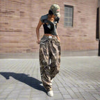 Women's Y2K camouflage cargo pants by FitiqueFit featuring a casual, relaxed fit with multiple pockets and a trendy Y2K style.