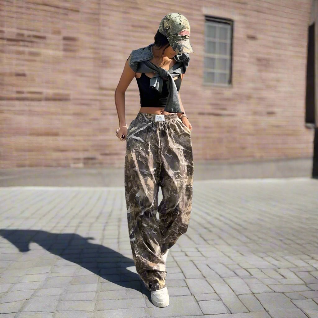 Women's Y2K camouflage cargo pants by FitiqueFit featuring a casual, relaxed fit with multiple pockets and a trendy Y2K style.