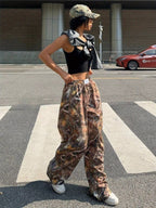 Women’s Y2K camouflage cargo pants by FitiqueFit, showing relaxed casualwear style with pockets and a trendy camo pattern.