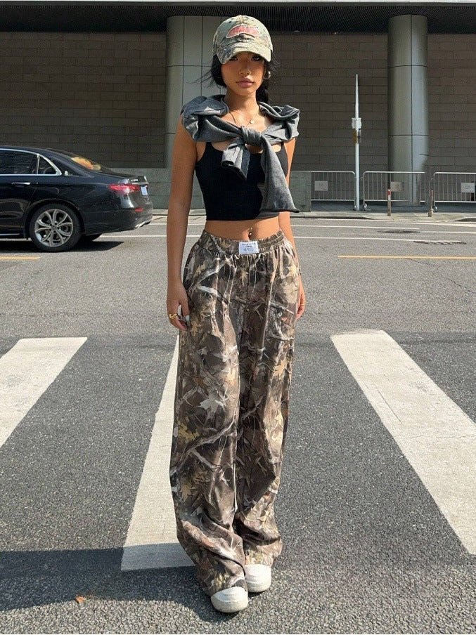 Women's Y2K camouflage cargo pants from FitiqueFit featuring relaxed casualwear with a trendy military-inspired print.