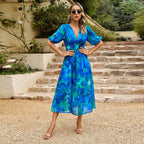 Summer floral V-neck dress for women by Dukun Design, featuring a vibrant floral pattern and lightweight fabric.
