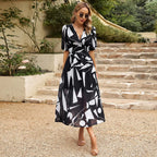 Women’s summer floral V-neck dress by Dukun Design featuring lightweight fabric and vibrant floral pattern.