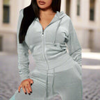 FitiqueFit casualwear set with a zip-pocket hooded crop top and slim-fit pocket pants, featuring drawstring details and comfortable fit.