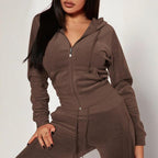 FitiqueFit casualwear set with zip-pocket hooded crop top and slim-fit pocket pants, featuring drawstrings and a relaxed fit.